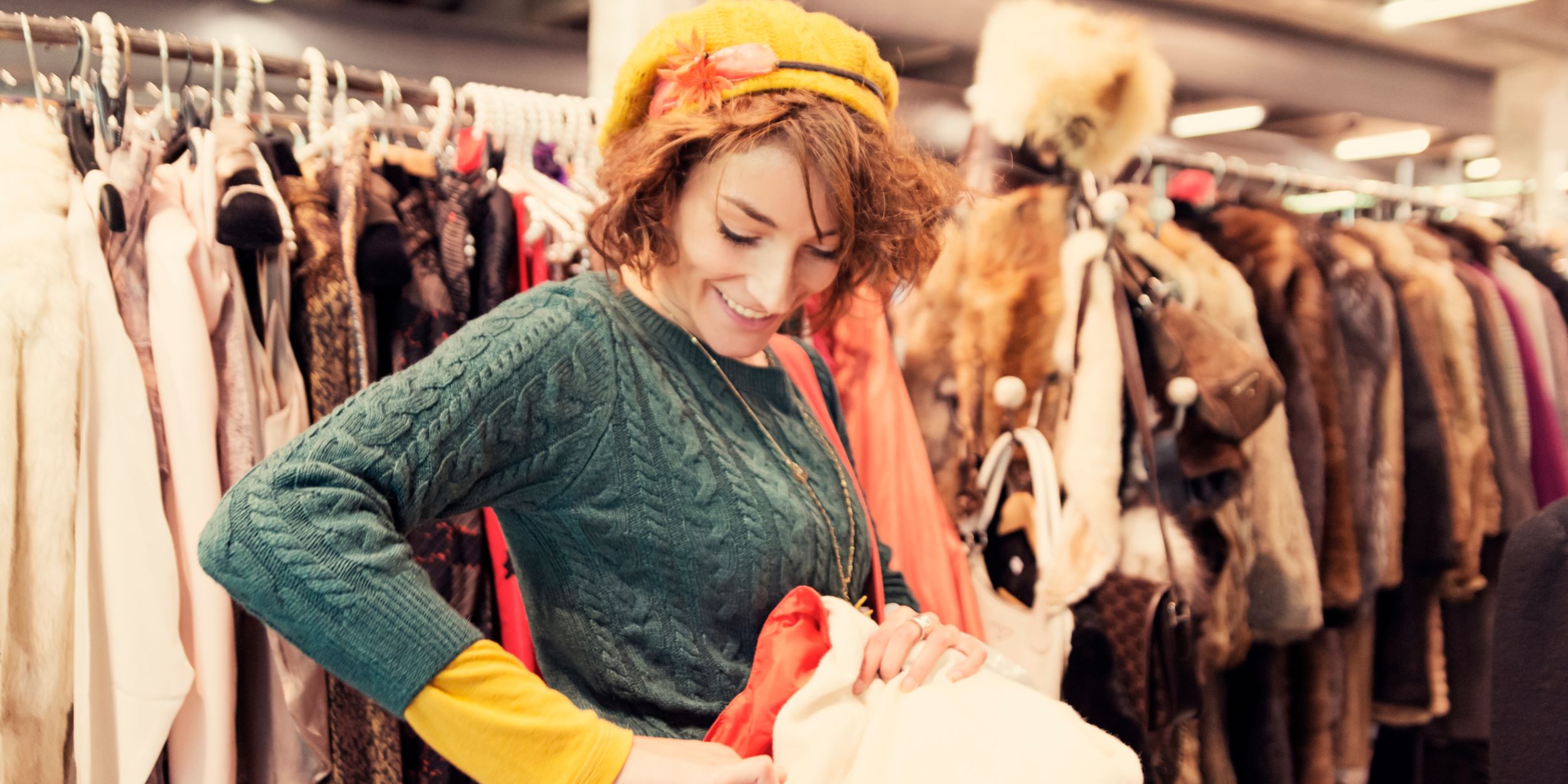 Woman in a vintage clothing store doing her bit for the circular fashion economy