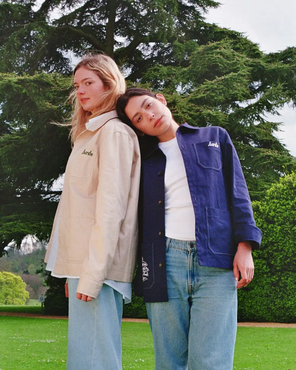 Herbs Embroidered Work Jacket - Sand - Limited Edition & Herbs Embroidered Work Jacket - Navy - Limited Edition worn by models in a field