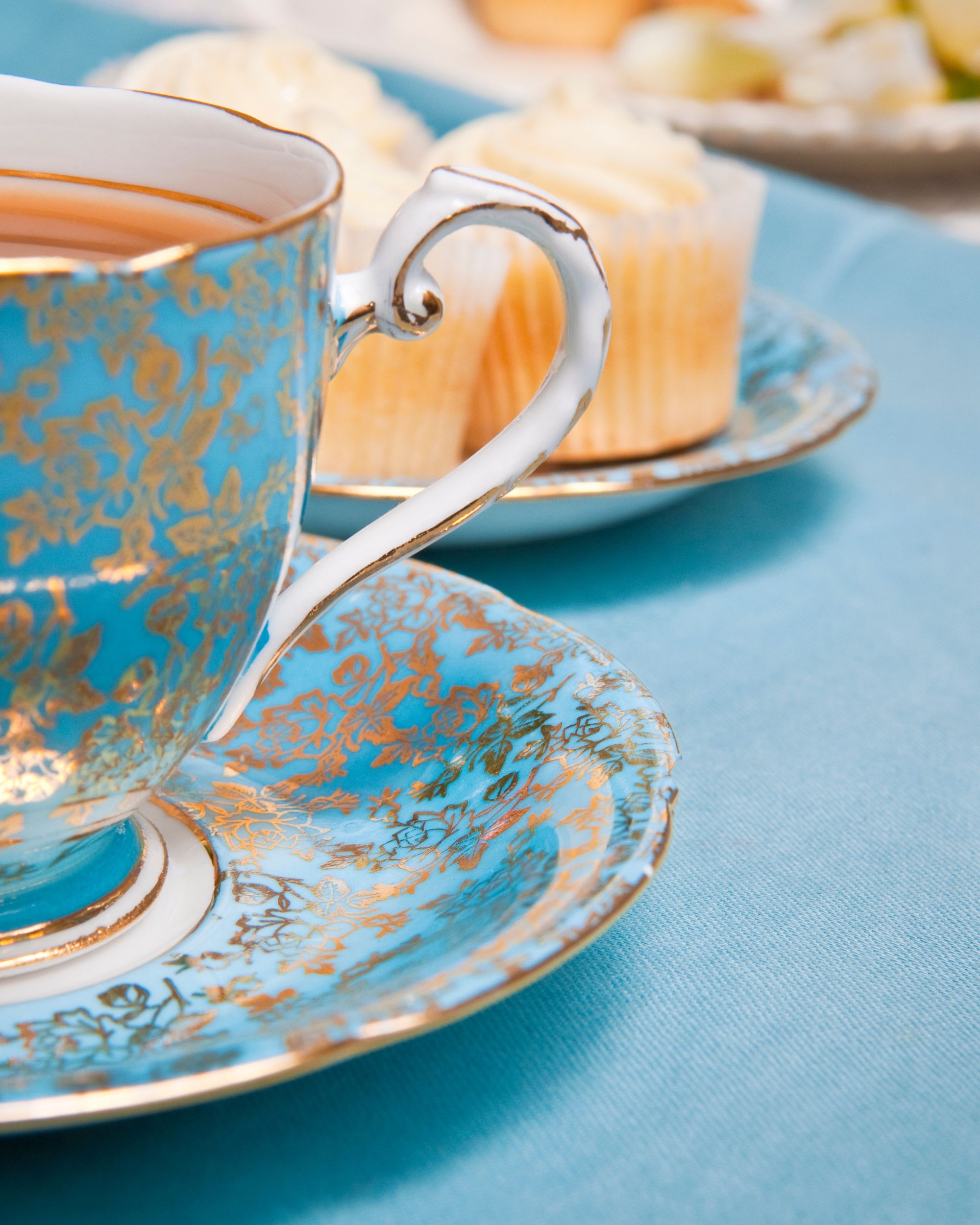 Blue China and gold tea cup and saucer in a cafe in London