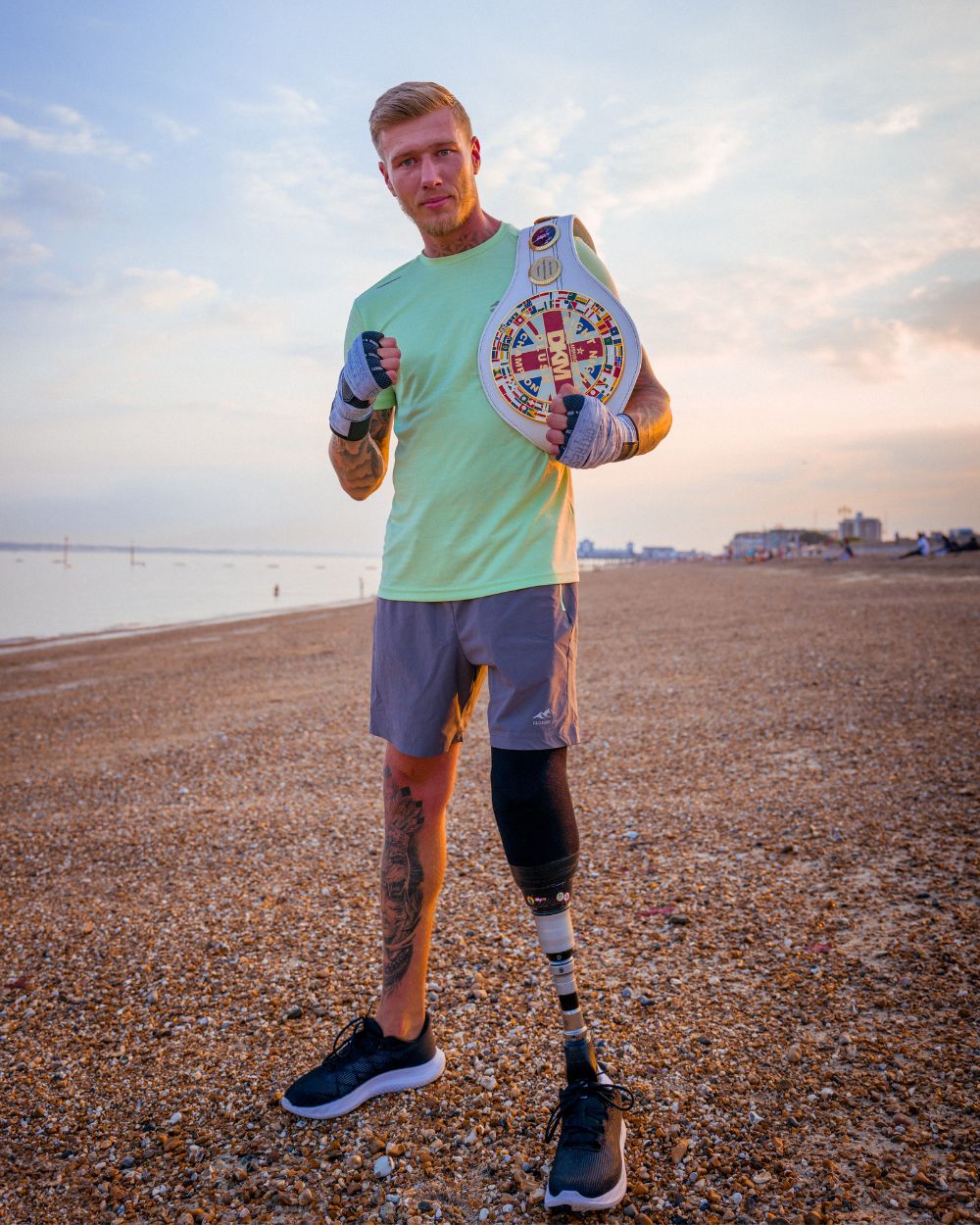 Fighters - Matt Edwards with boxing title poses on a beach