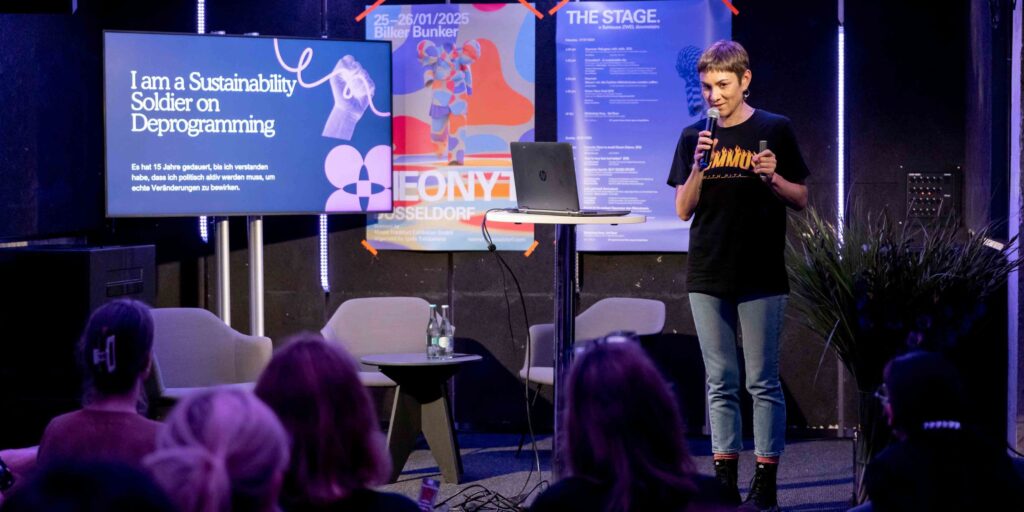 Lavinia Muth speaking at an event