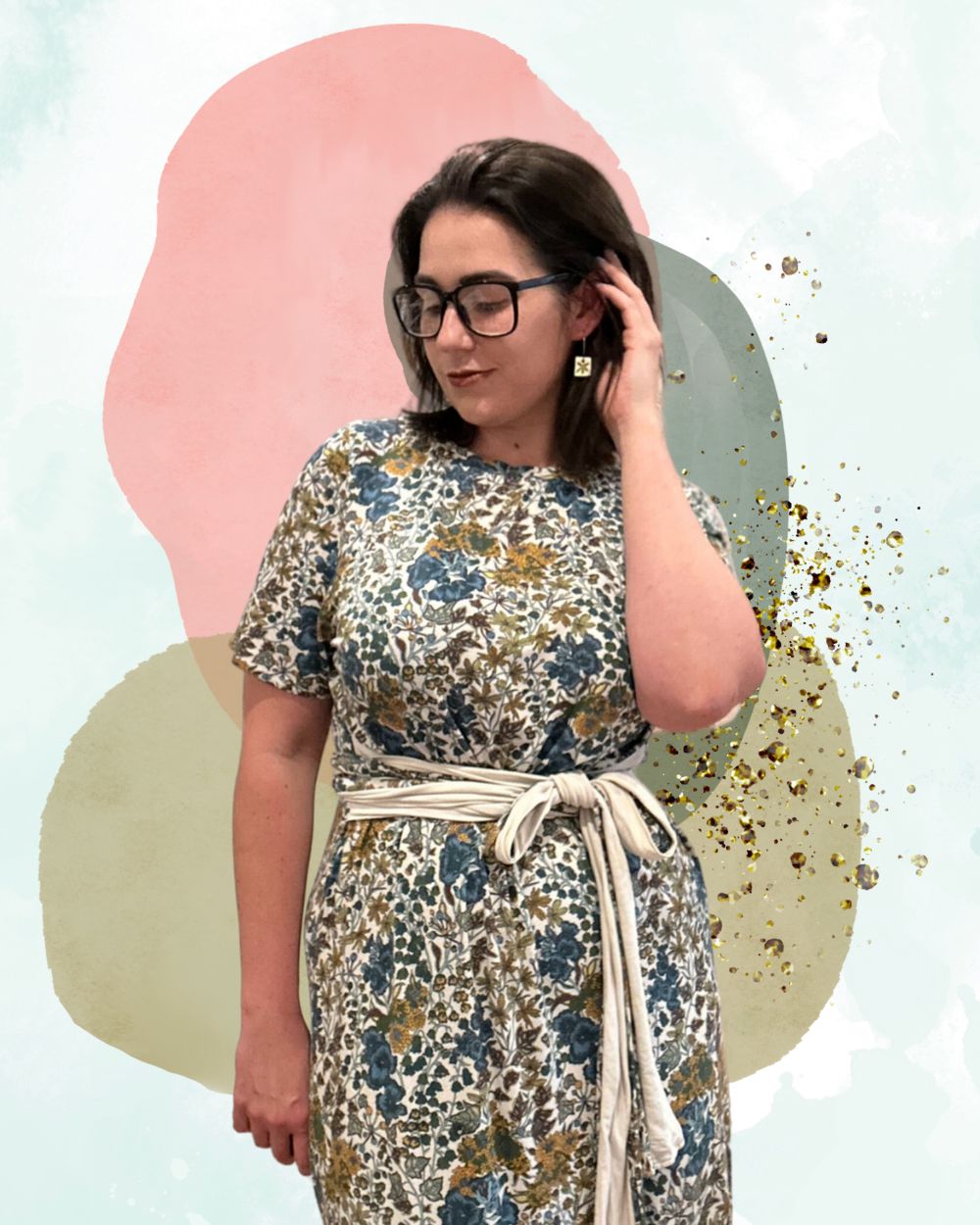 Annie Stafford in a green and brown print dress with a belt