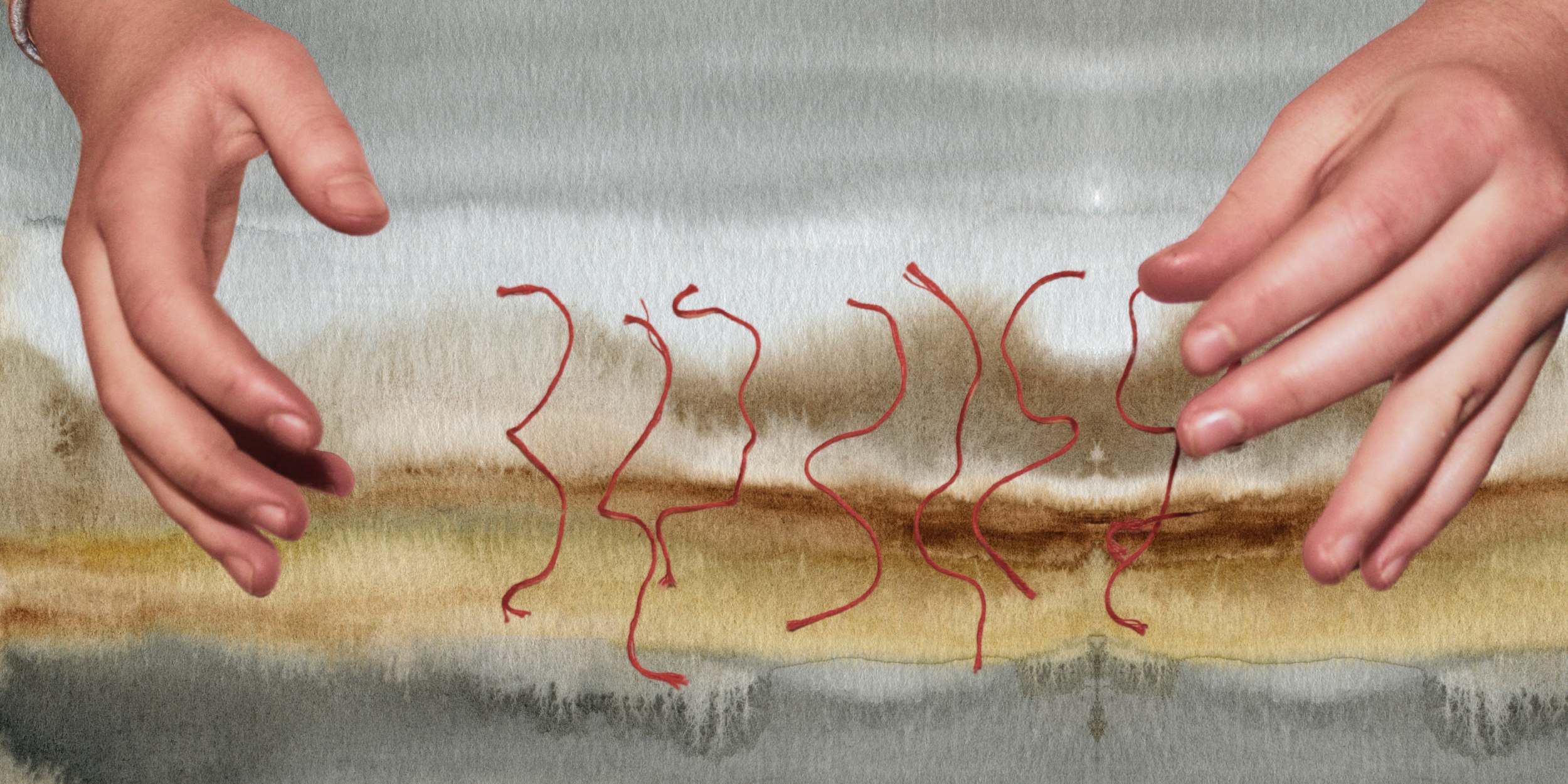 Two hands above some red threads with an earthy watercolour background, tailored clothing