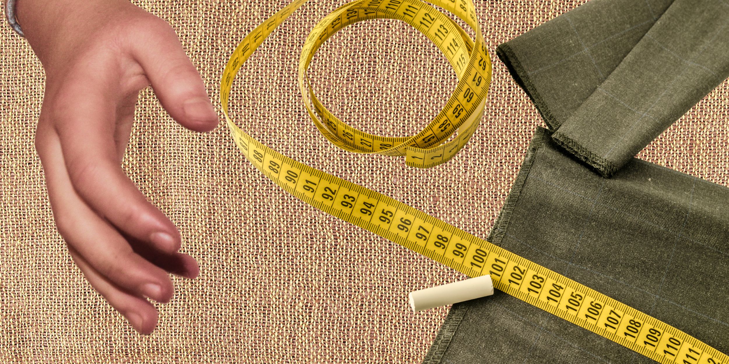Lost art of tailored clothing with a tape measure and chalk with a hand
