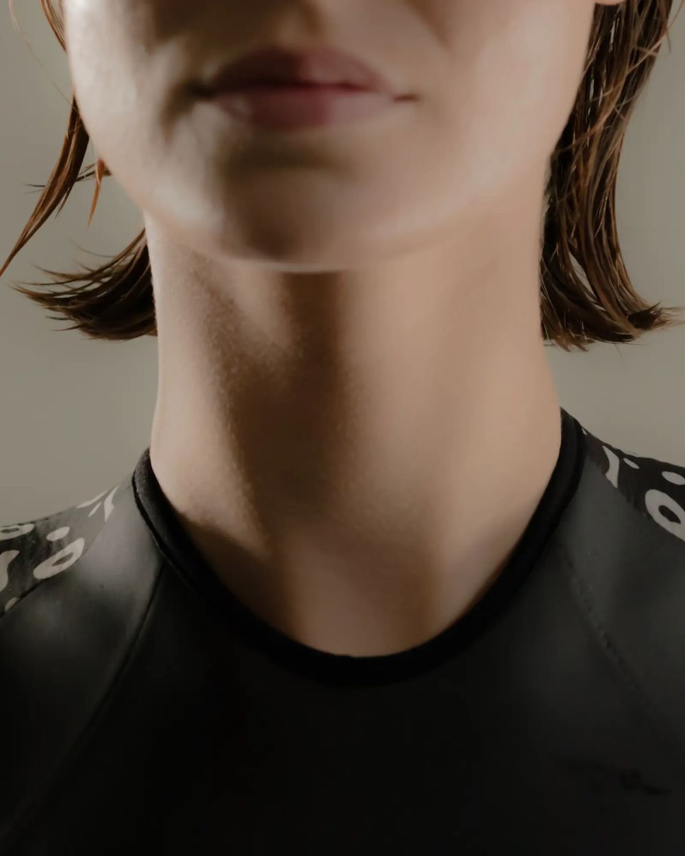 Scales SwimSkin with model, swimsuit collar detail