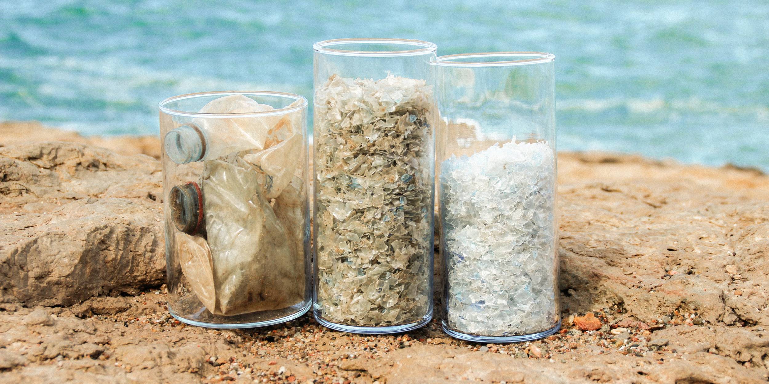 Seaqual Initiative Plastic Raw Materials on a beach in containers