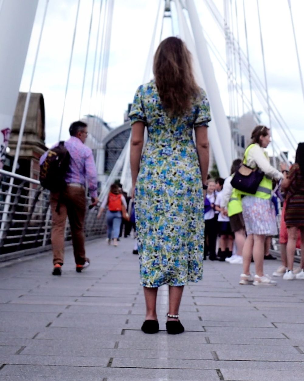 Still from the Still Here? Short film with actress and Co-Director Solène Anglaret standing on a bridge