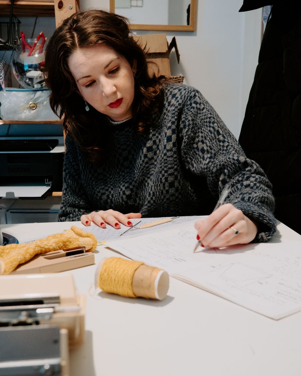 Elin Manon working on her knitwear range in her studio