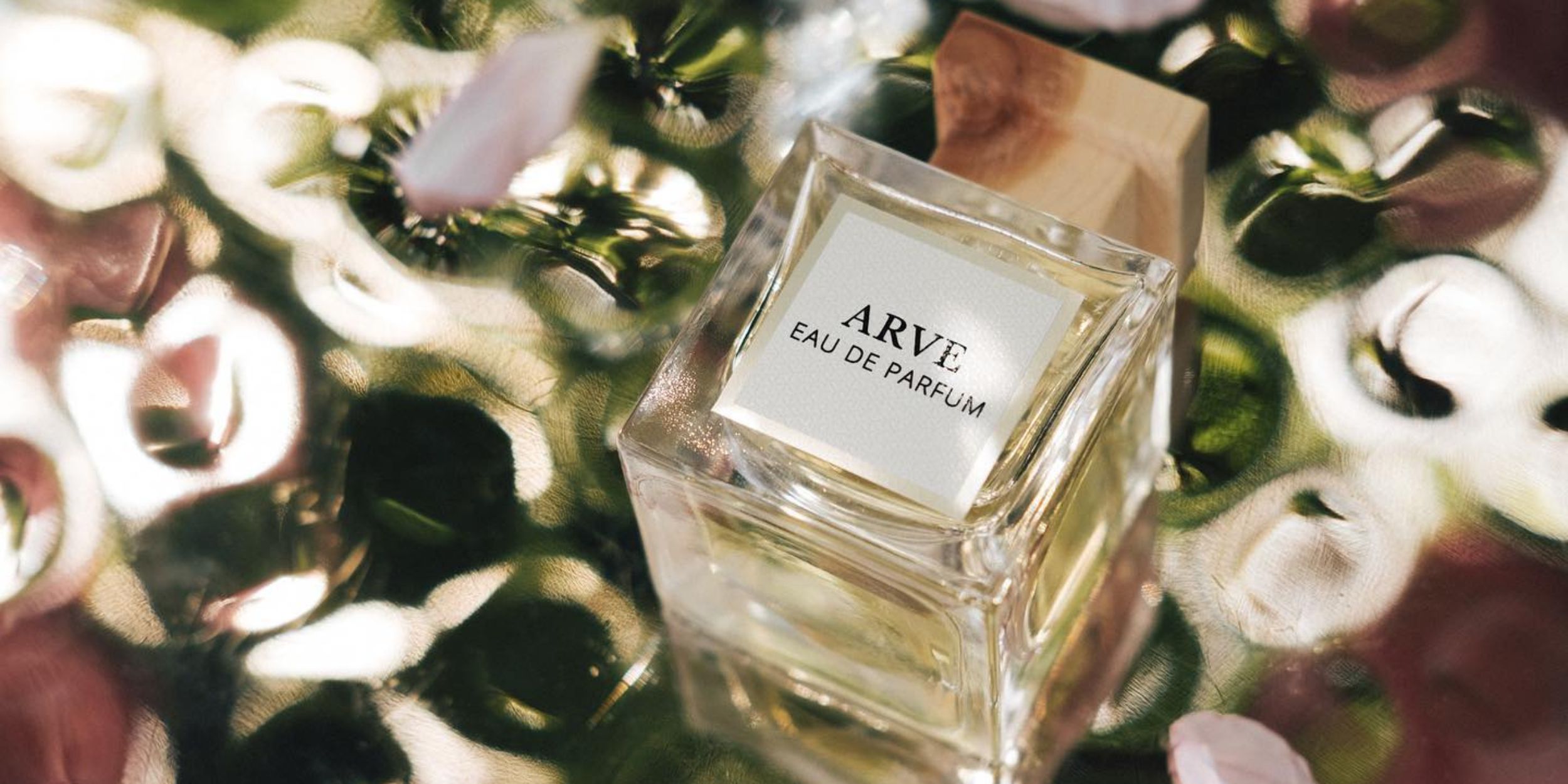 Arve Parfum bottle with a floral background