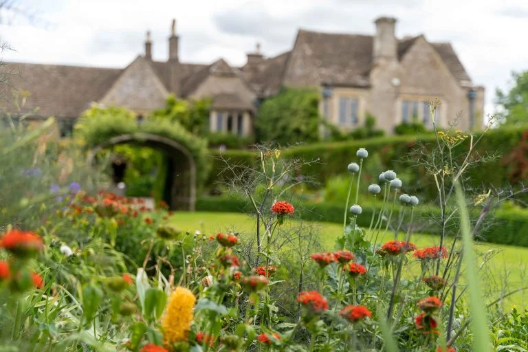 Whatley Manor Gardens with the Manor House in the background