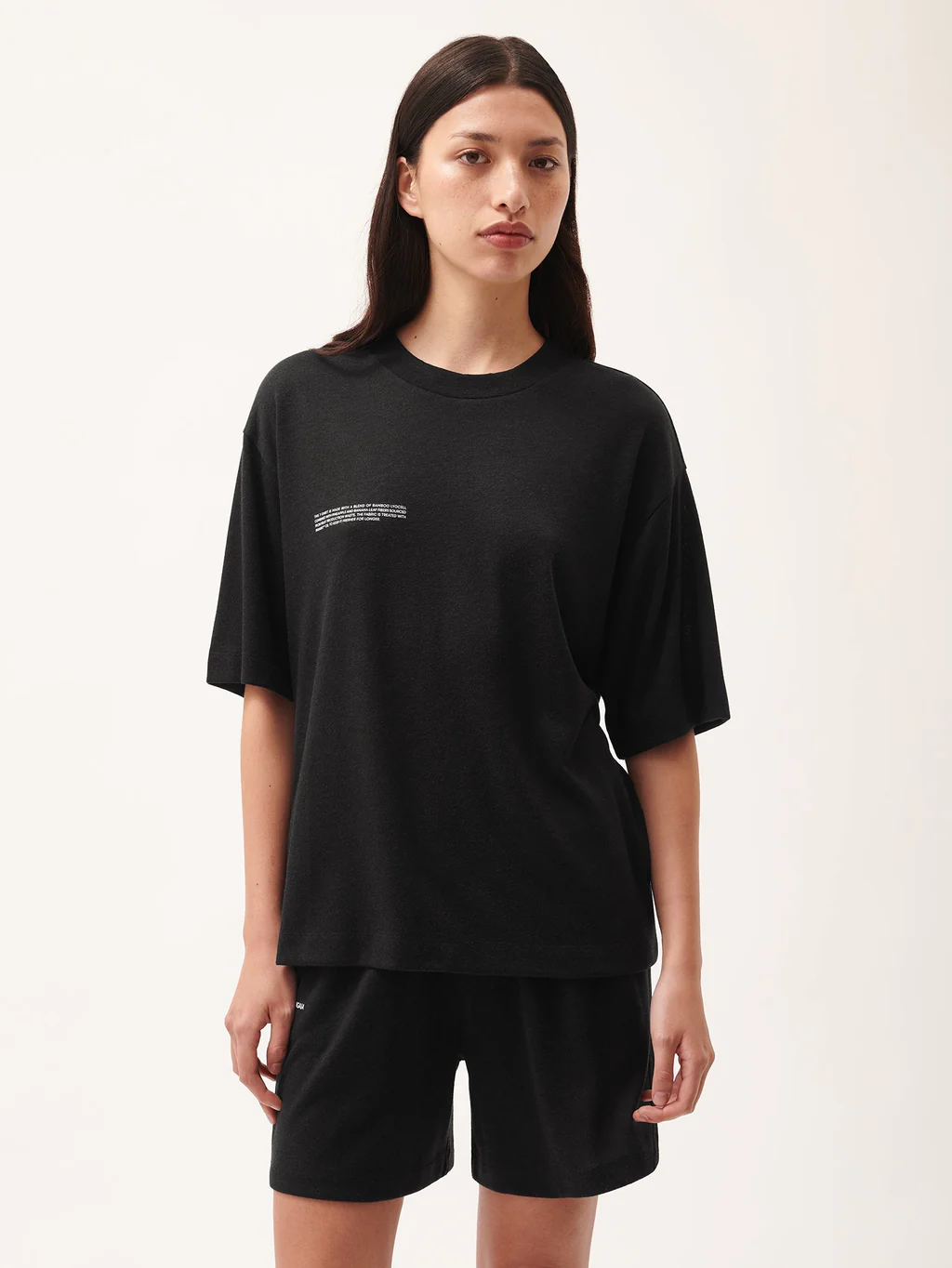 Model wearing the Pangaia FRUTFIBER T-shirt in Black Womens