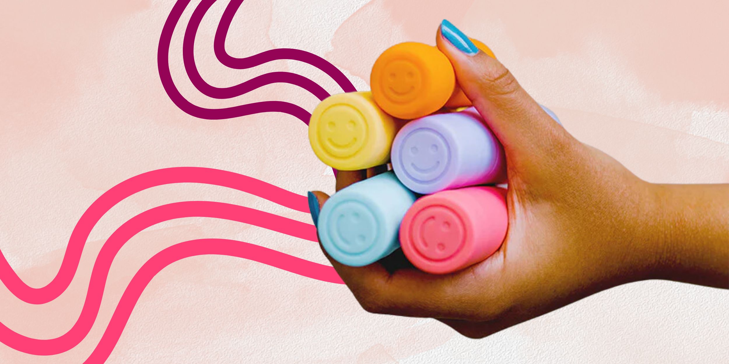 Smile Makers Women's Pleasure products held in a hand