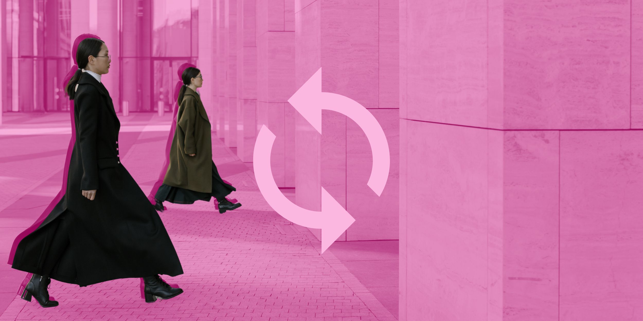 Two women walking into a fashion returns warehouse