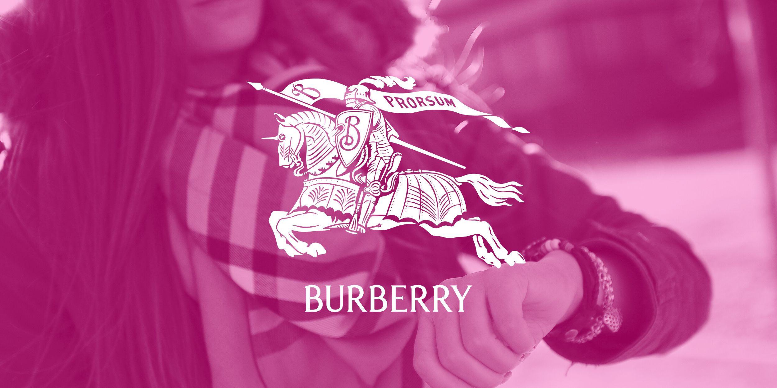ReBurberry logo in white in front of a person wearing a Burberry scarf
