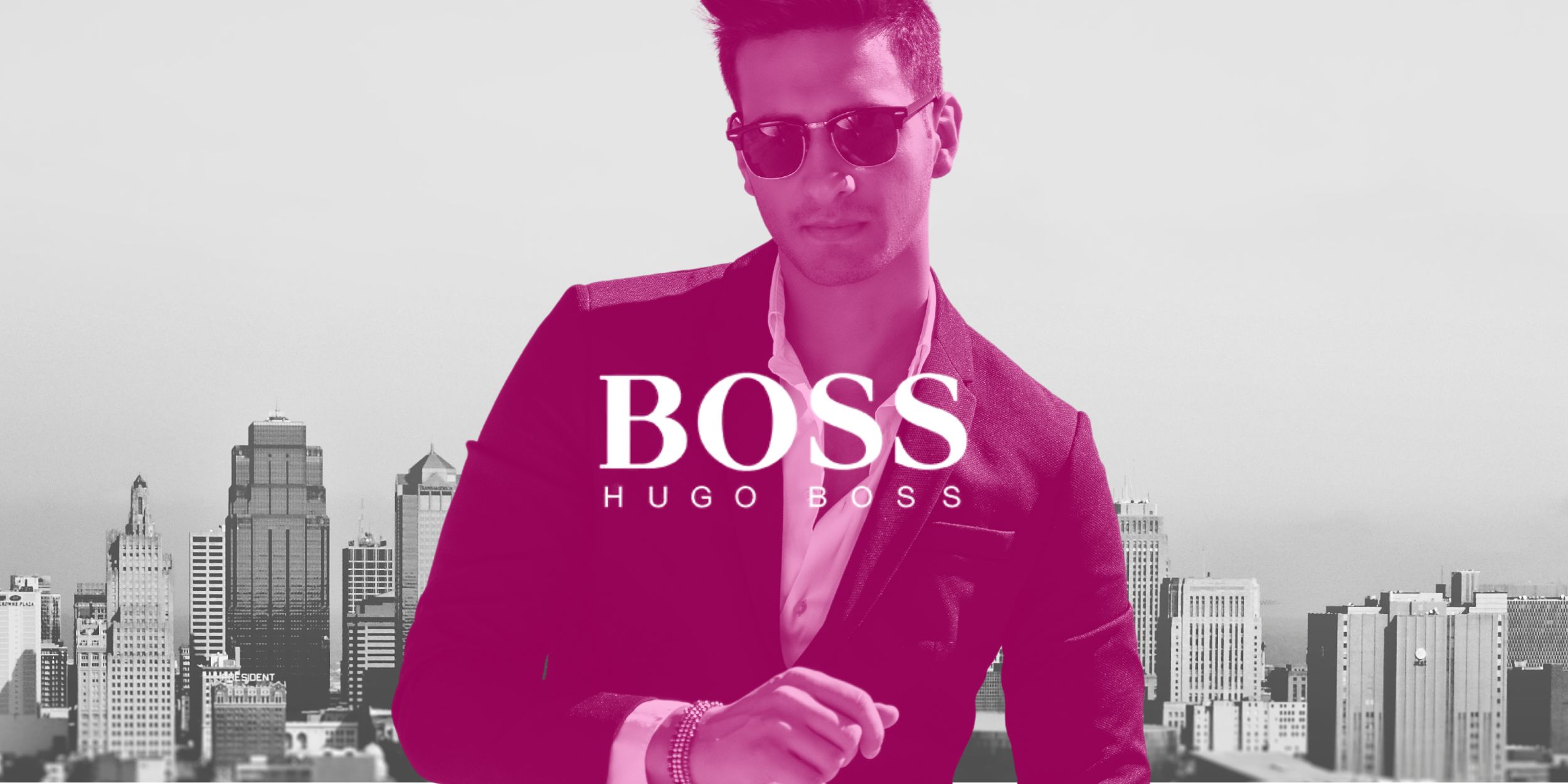 Man wearing a Hugo Boss suit in front of a city skyline