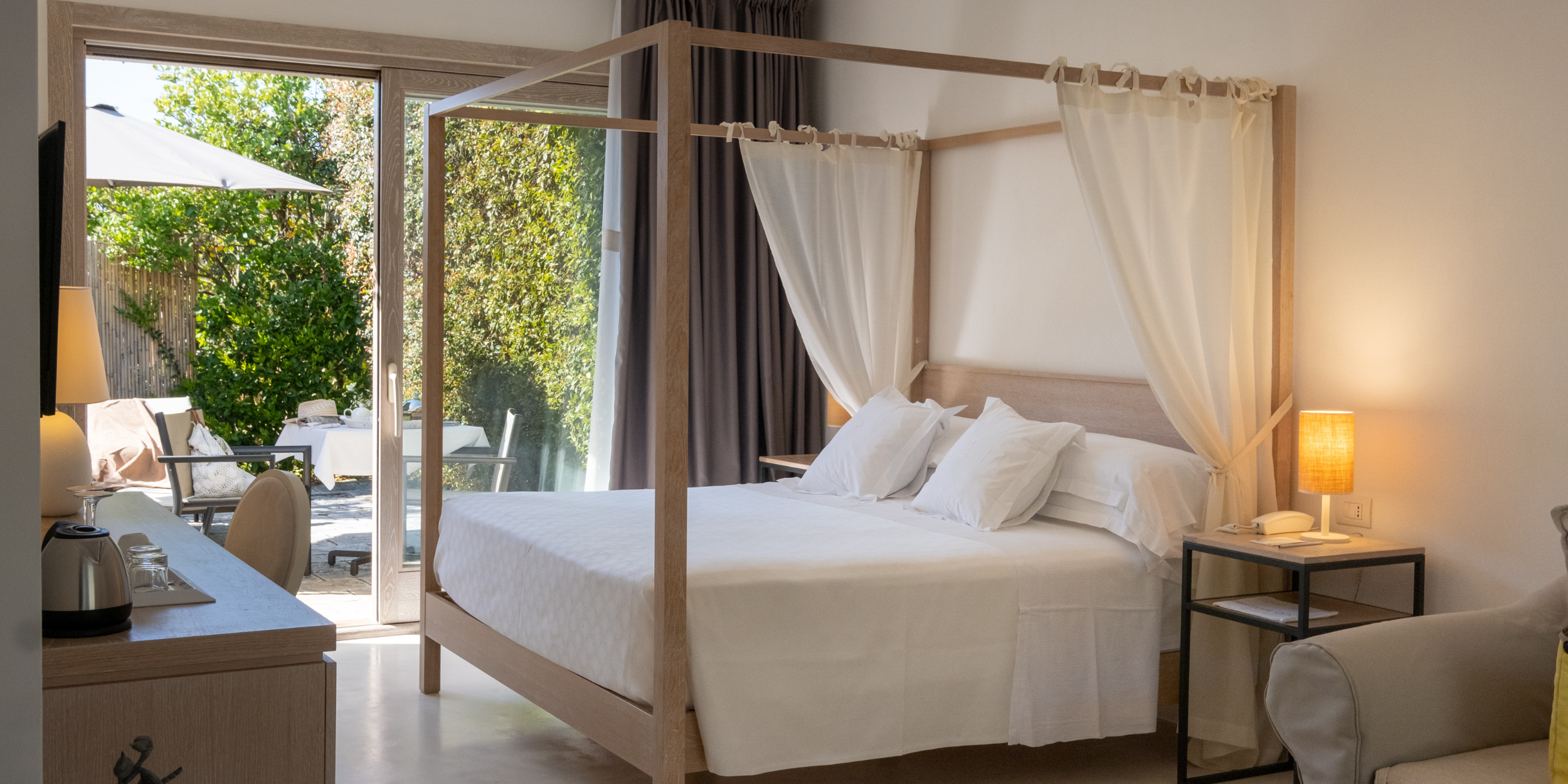 Interior Room View At Furnirussi Tenuta of Queen size bed and window.