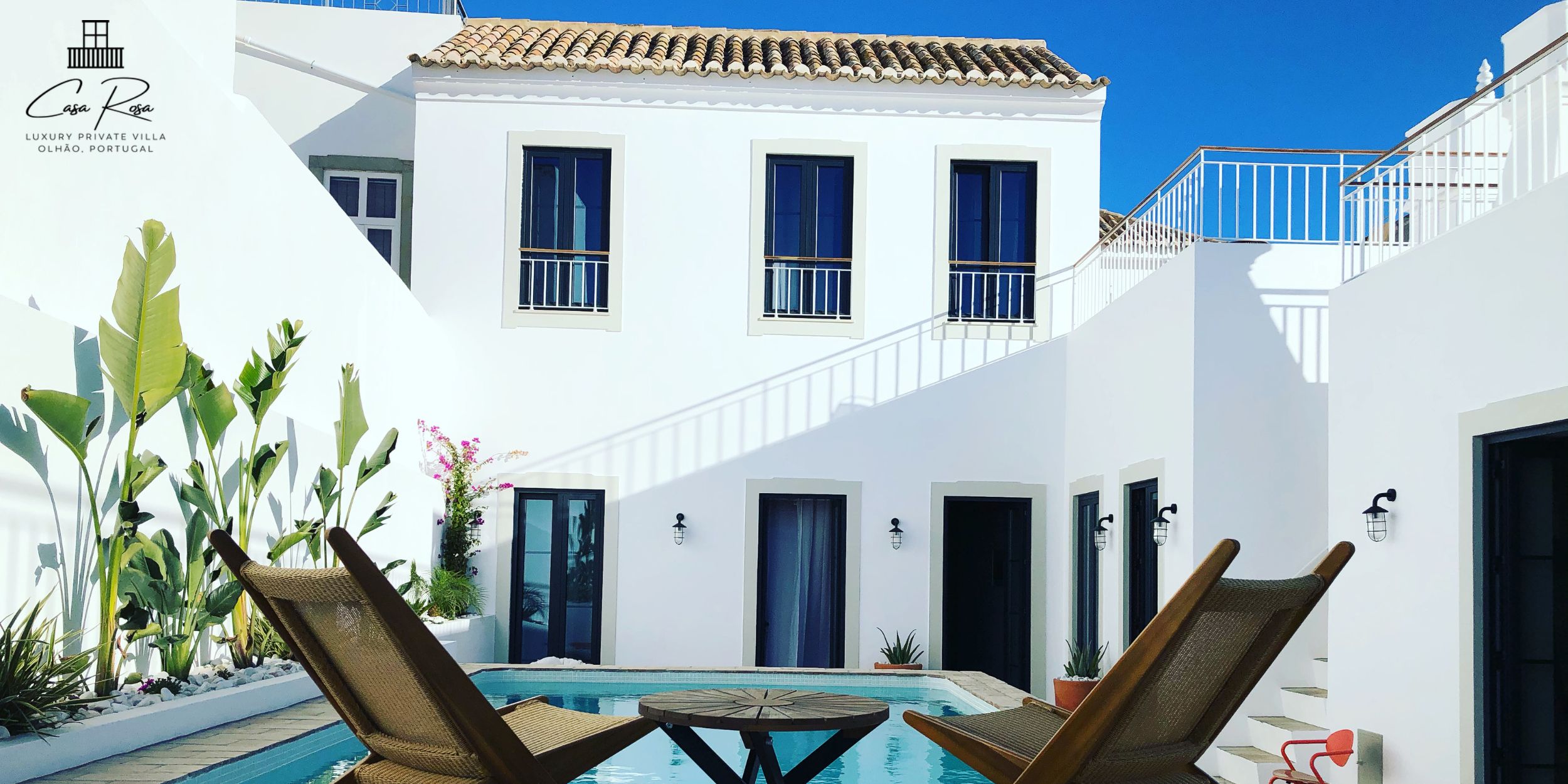 Casa Rosa Villa in Algarve, Portugal Poolside with deck chairs