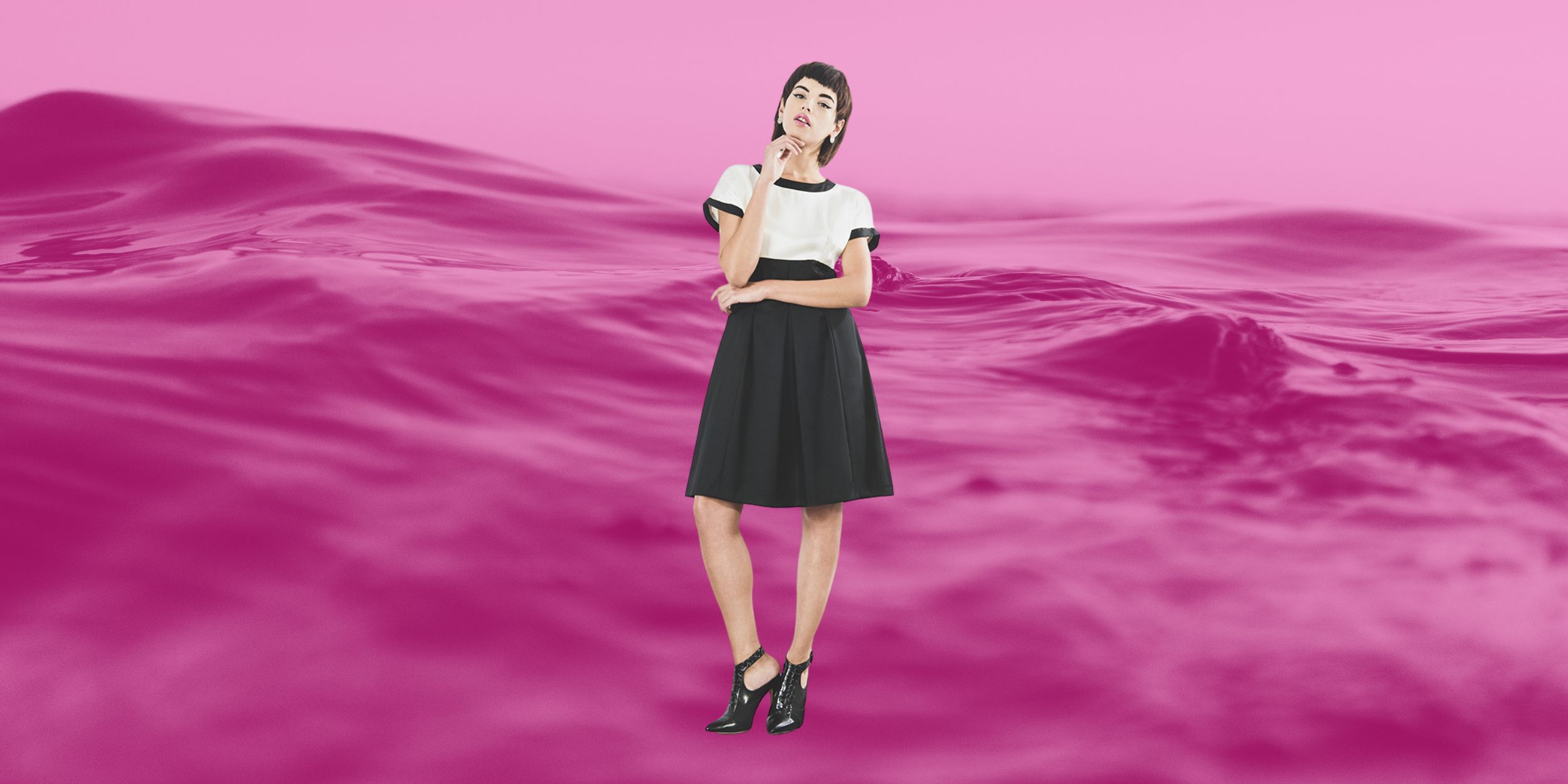 Outsider fashion outsider black and white shift dress hemp silk organic wool ethical fashion dress in front of a body of water