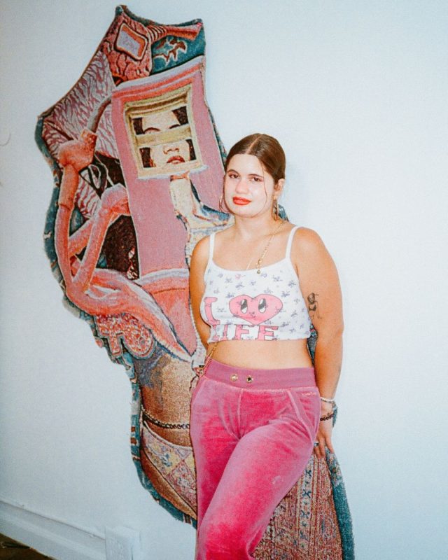 Vita Kari In Front Of Their Art Work