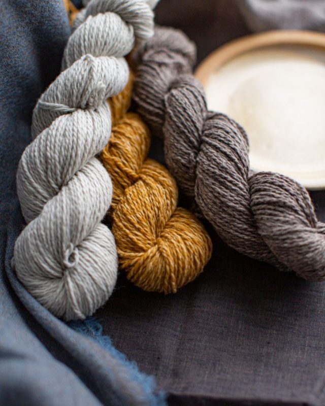 Brooklyn Tweed Dapple Yarn in grey, mustard and light brown